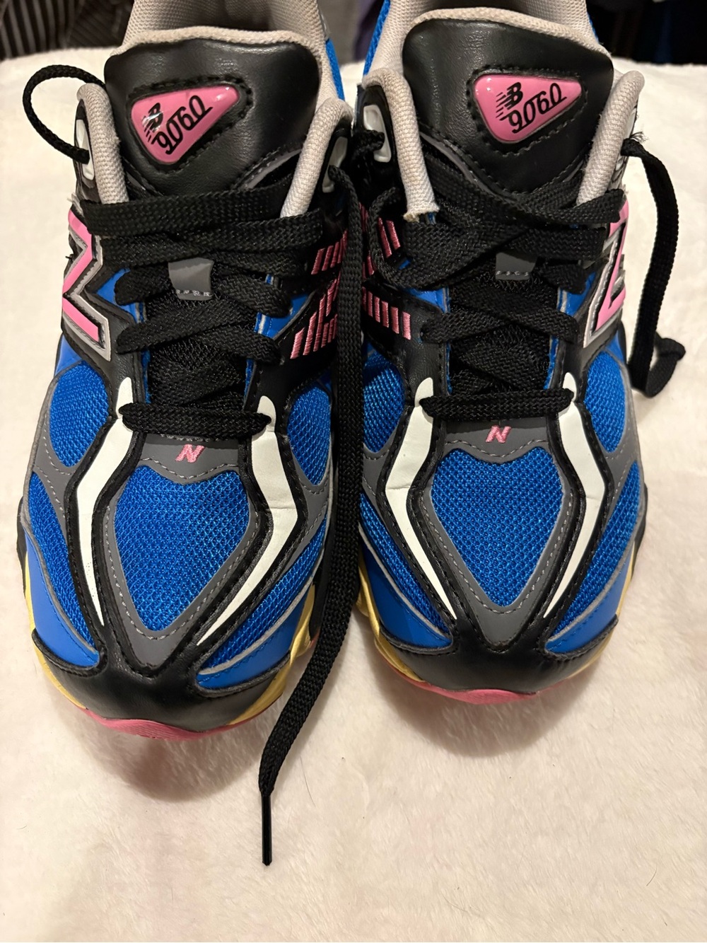 New Balance 9060 in the "Blue Oasis/Real Pink" colorway.